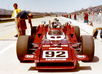 Carroll Smith works on an Indy Car at Ontario Motor Speedway, 1970.